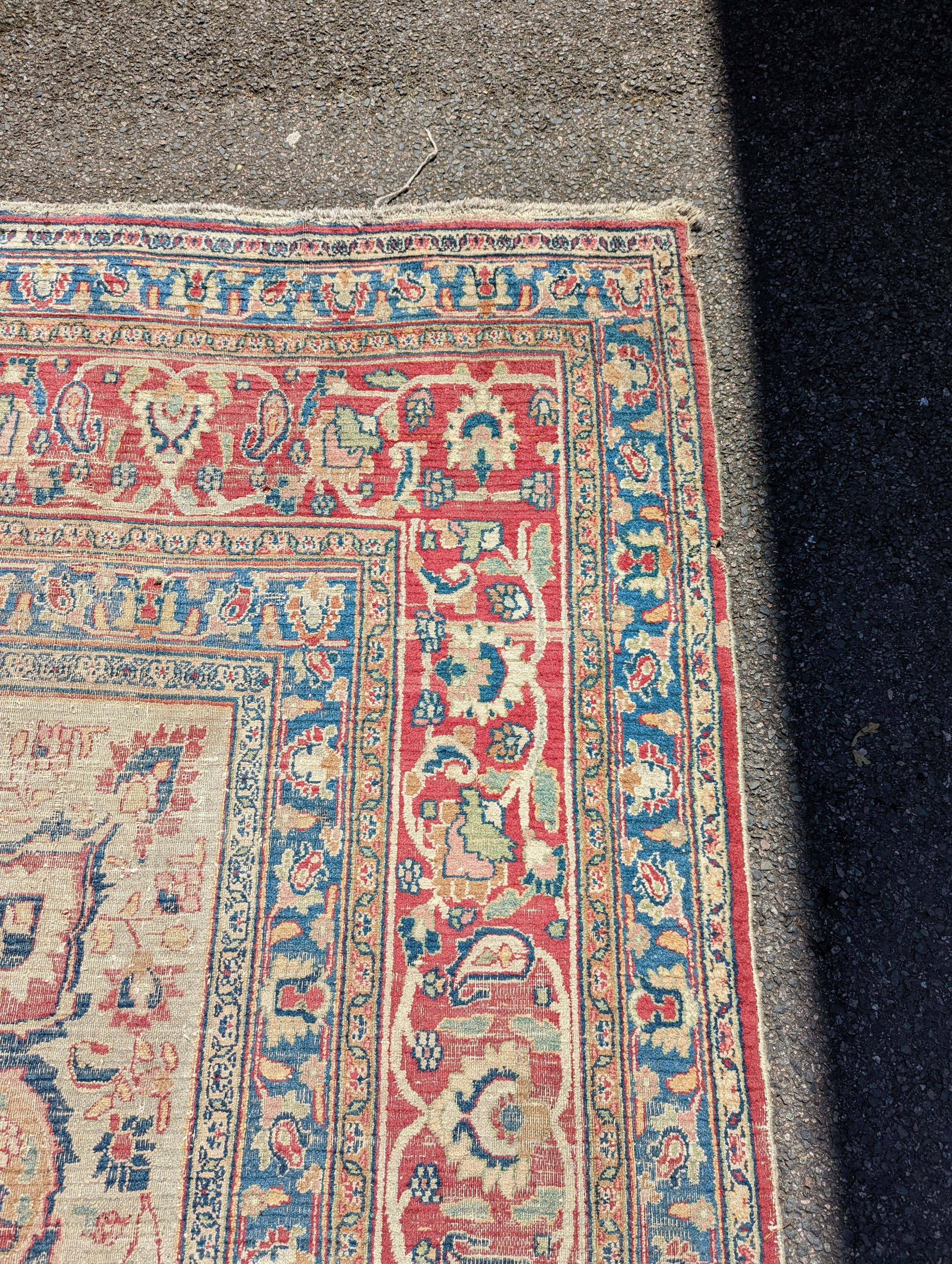 An Isfahan ivory ground carpet, 432 x 330cm